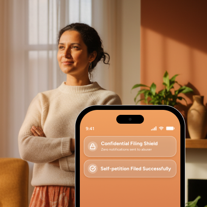 Woman at home with a phone showing a confidential VAWA self-petition filing