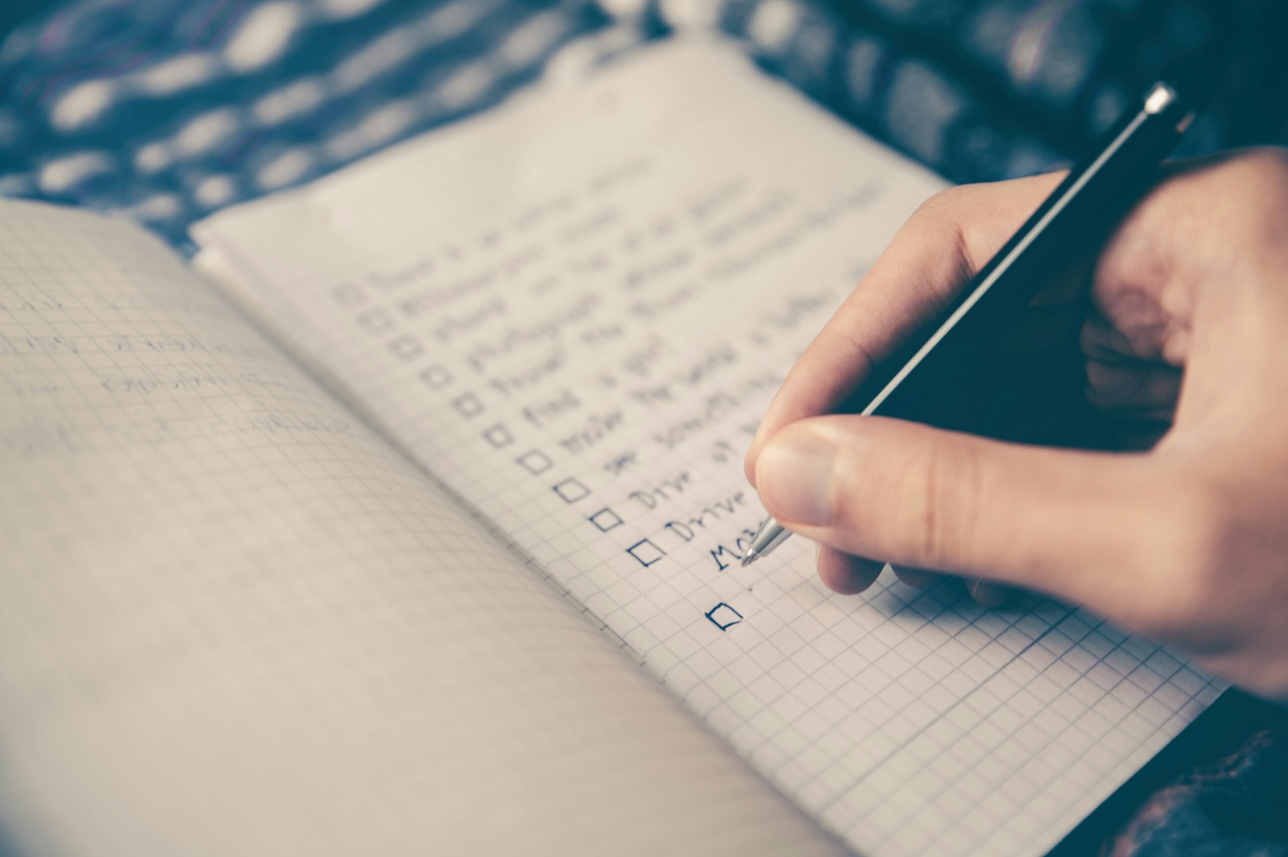 Someone working on a checklist