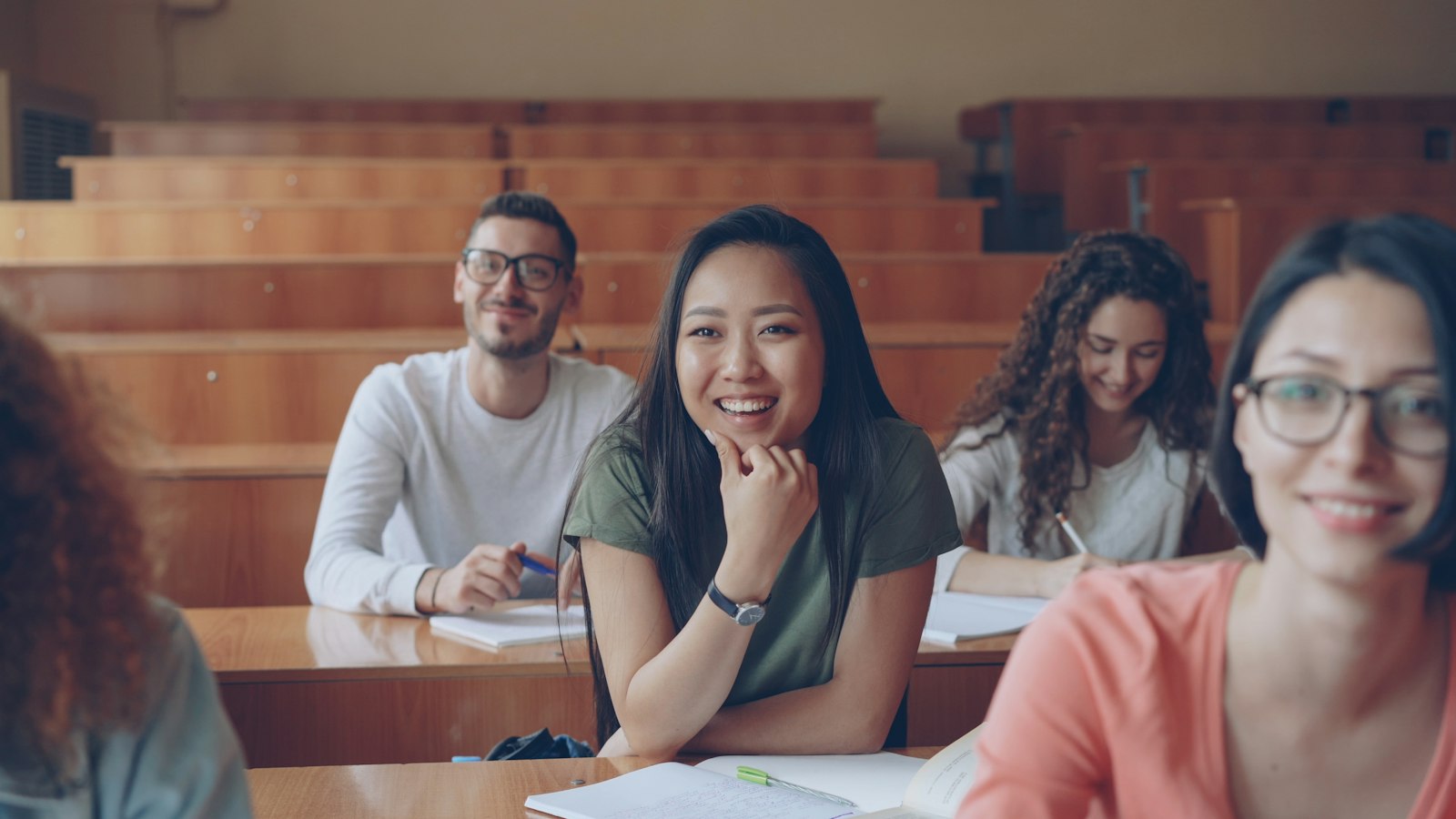 College students in a lecture hall, illustrating SIJS and financial aid questions