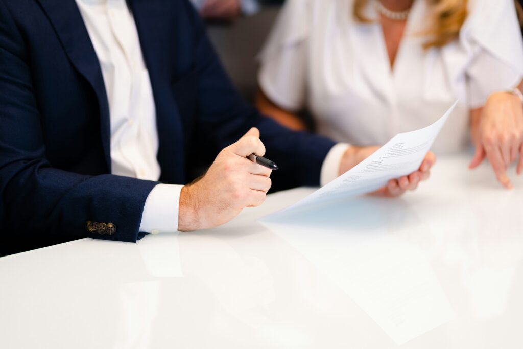 two people discussing documents